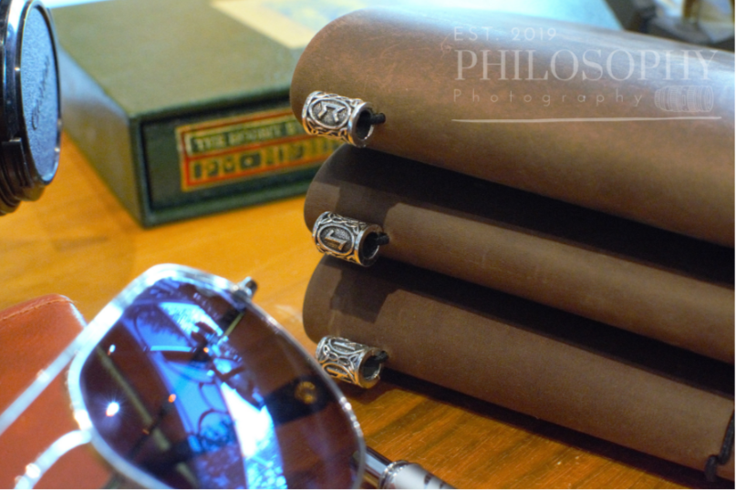 Odyssey Notebook – custom leather travel journal in brown and black with Nordic rune designs and Thor’s Hammer motif