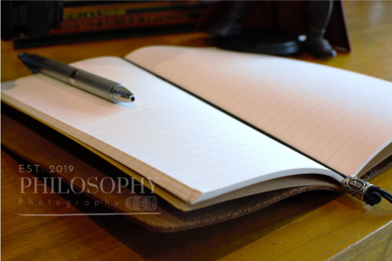 Odyssey Notebook – custom leather travel journal in brown and black with Nordic rune designs and Thor’s Hammer motif
