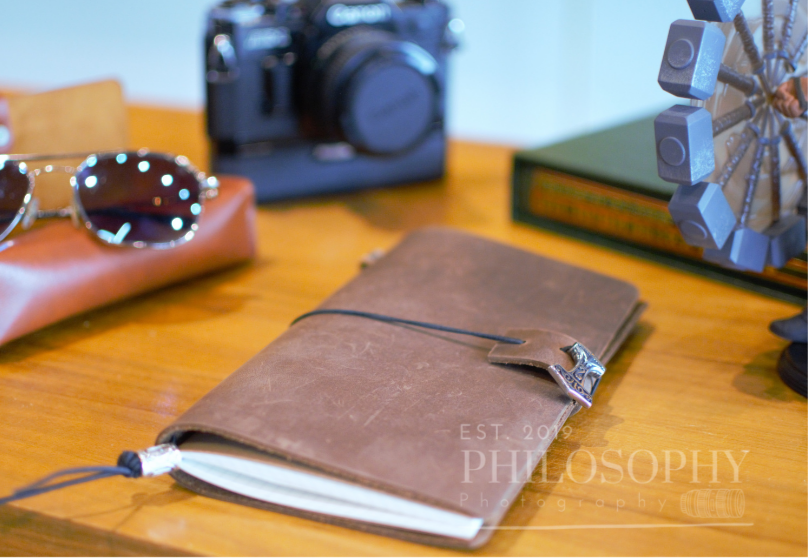 Odyssey Notebook – custom leather travel journal in brown and black with Nordic rune designs and Thor’s Hammer motif