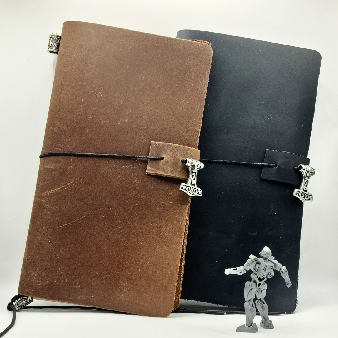 Odyssey Notebook – custom leather travel journal in brown and black with Nordic rune designs and Thor’s Hammer motif